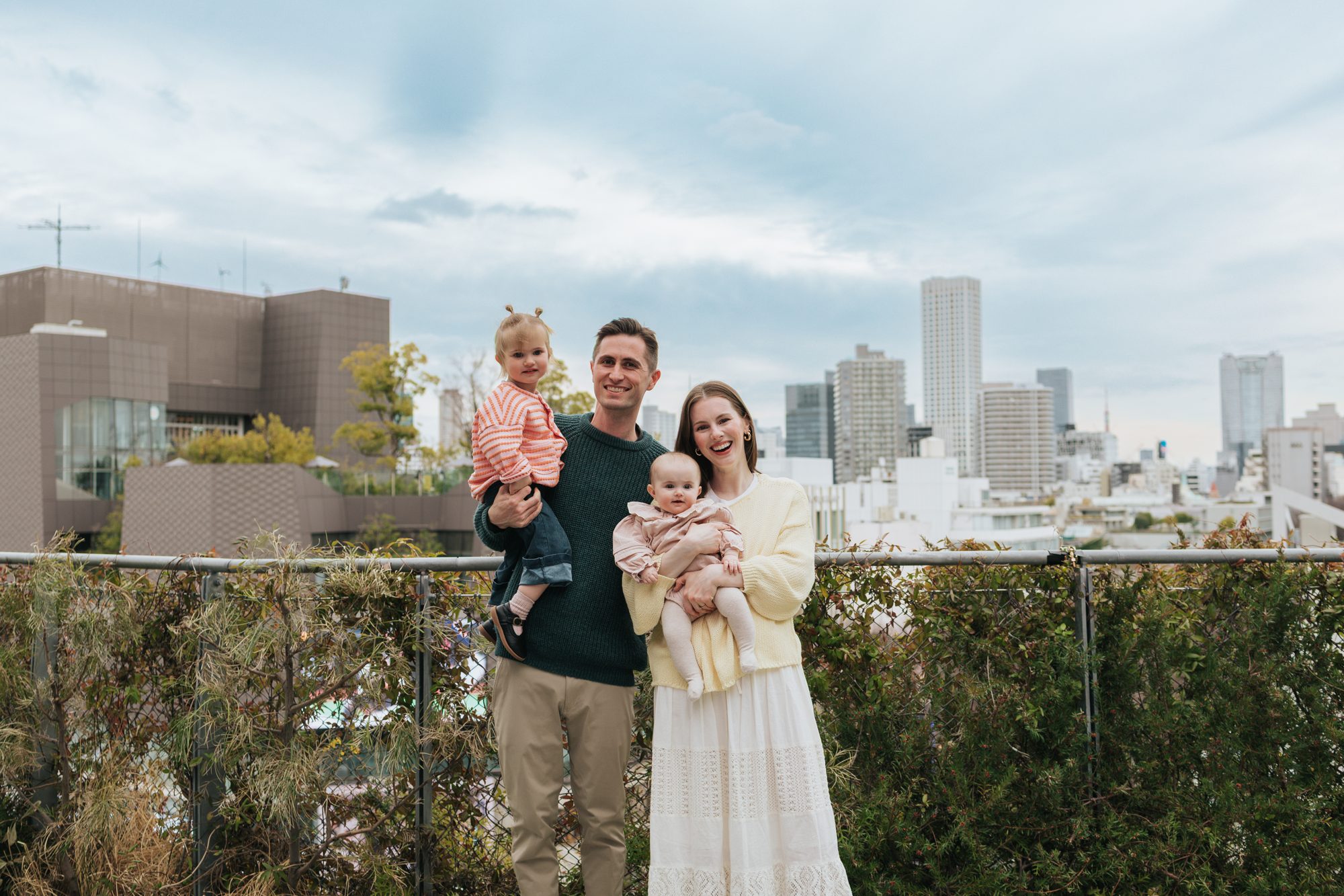 Kyle, Elise, Yuna, and Juni on a rooftop in Tokyo