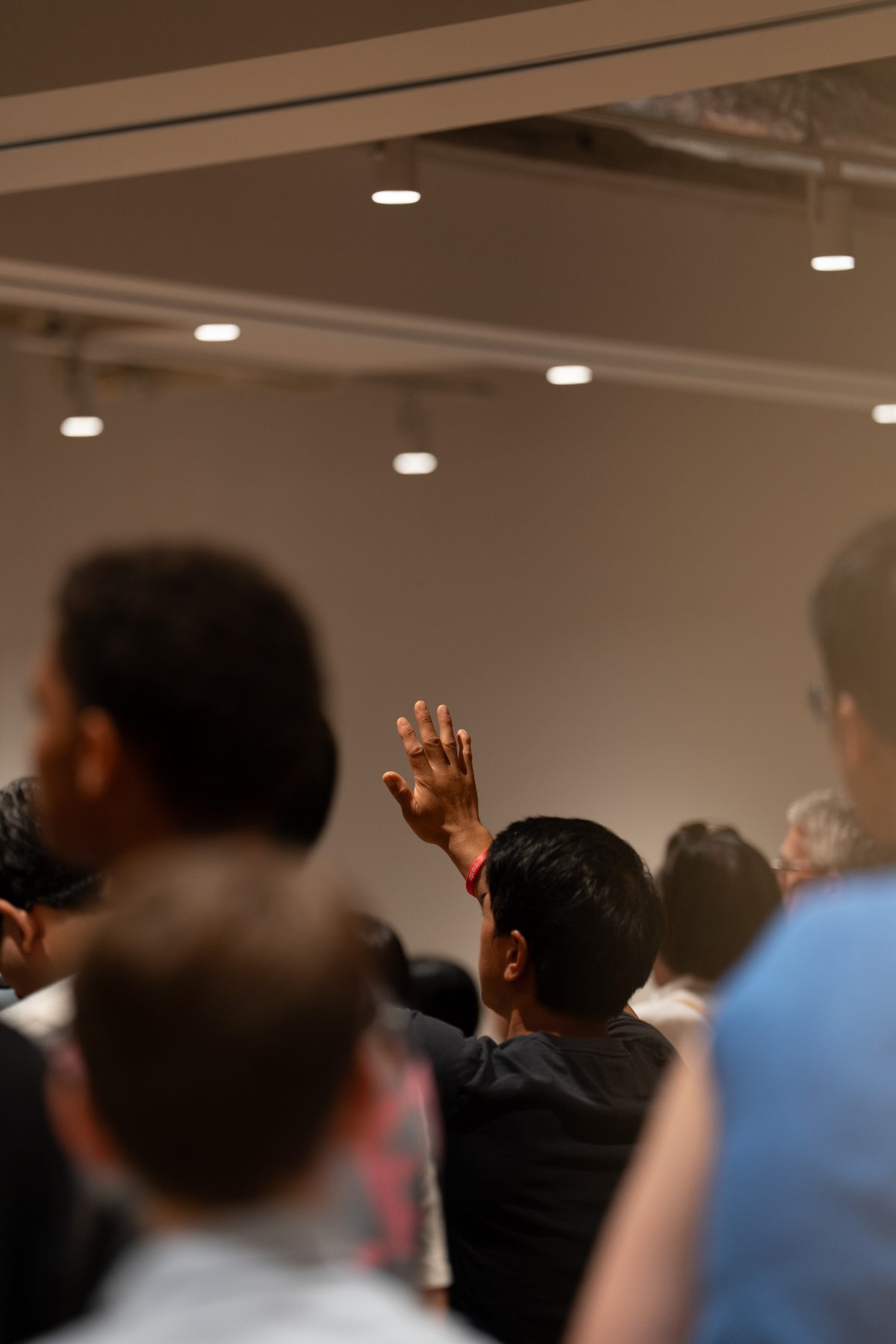 A man raising his hand in worship